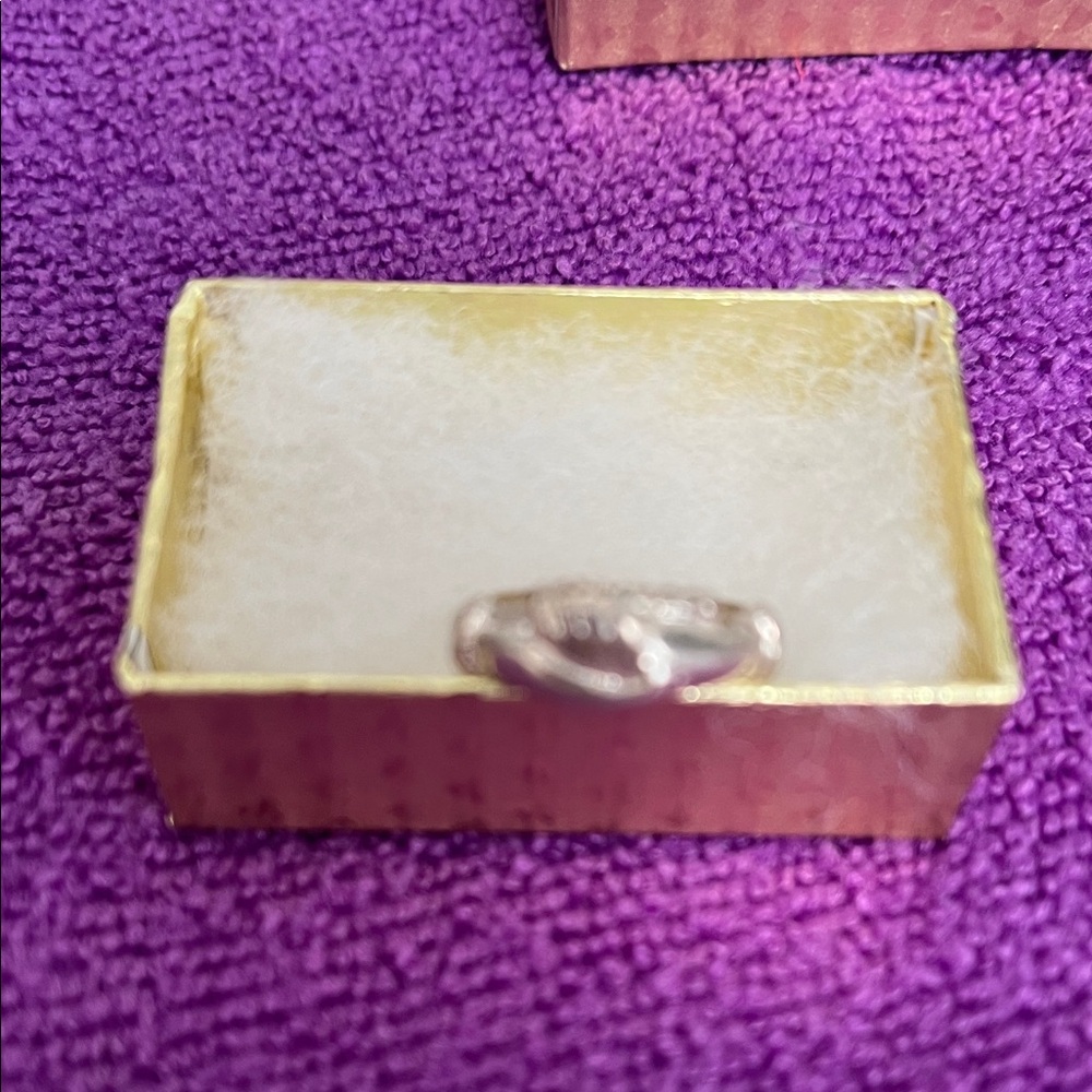 Sterling silver double holding hands ring with Subtle Detail.